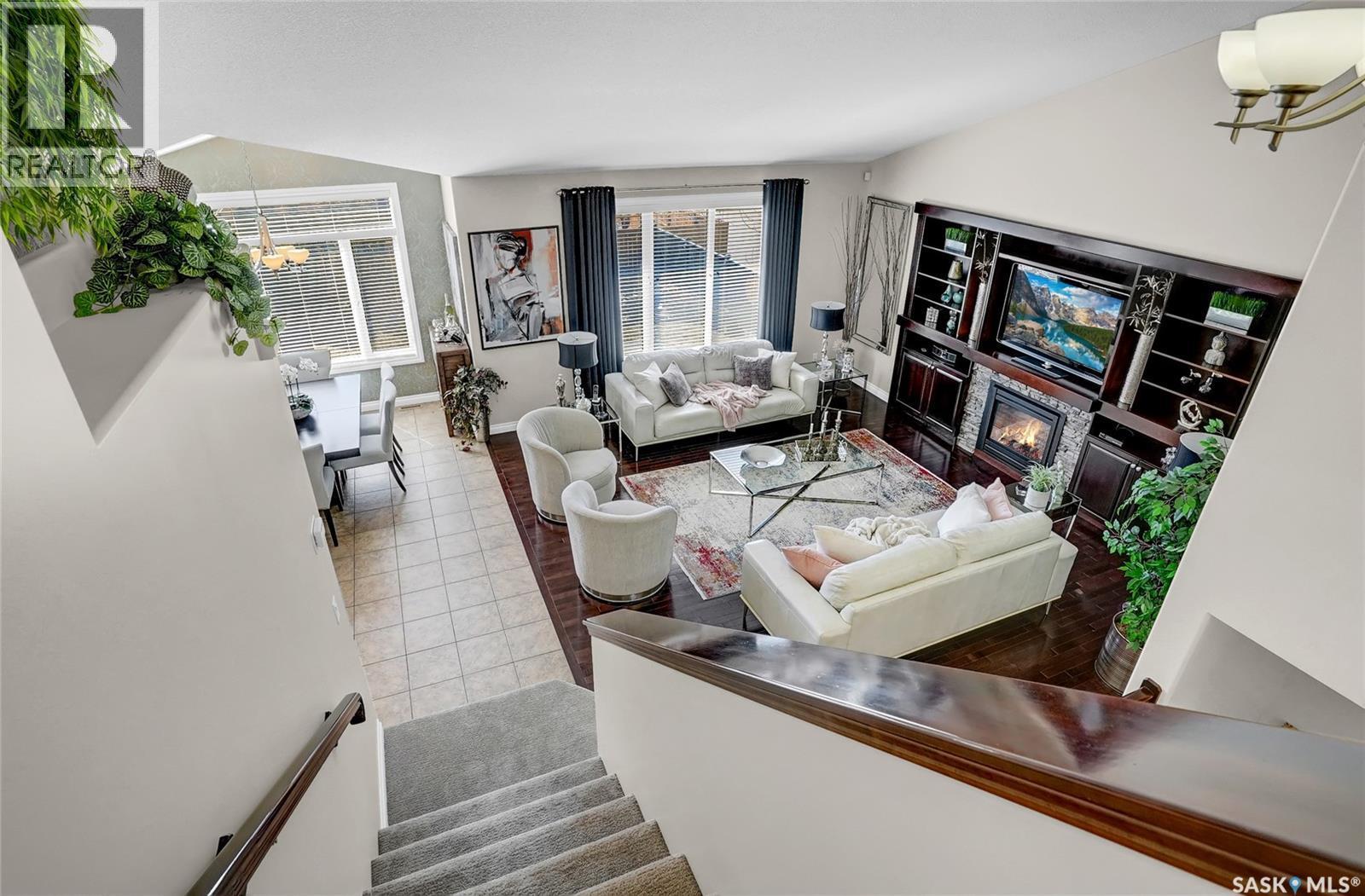 4839 Mazinke Crescent, Regina, SK - Indoor Photo Showing Living Room With Fireplace