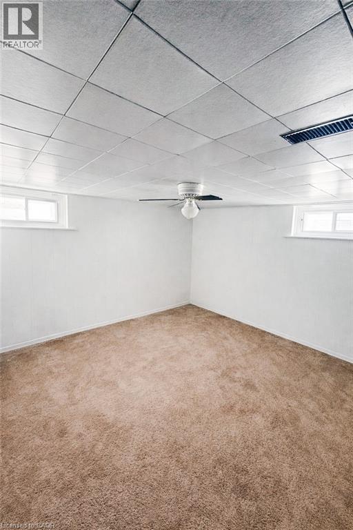 Carpeted room with white painted walls and a drop ceiling - 34 Christopher Drive, Cambridge, ON - Indoor