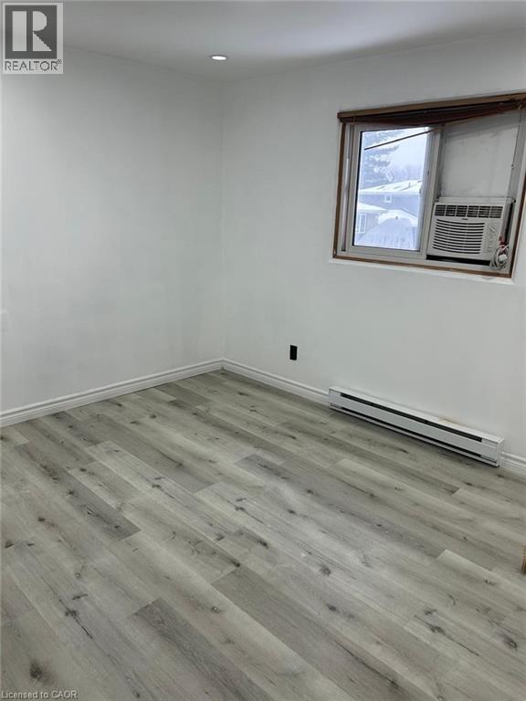 Room featuring light-toned wood-finish flooring, white baseboards, and white walls - 744 Parkview Crescent, Cambridge, ON - Indoor Photo Showing Other Room