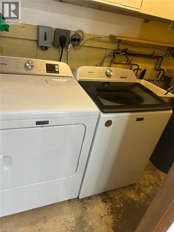 Dedicated laundry area featuring a white top-load washing machine and white electric dryer - 744 Parkview Crescent, Cambridge, ON - Indoor Photo Showing Laundry Room