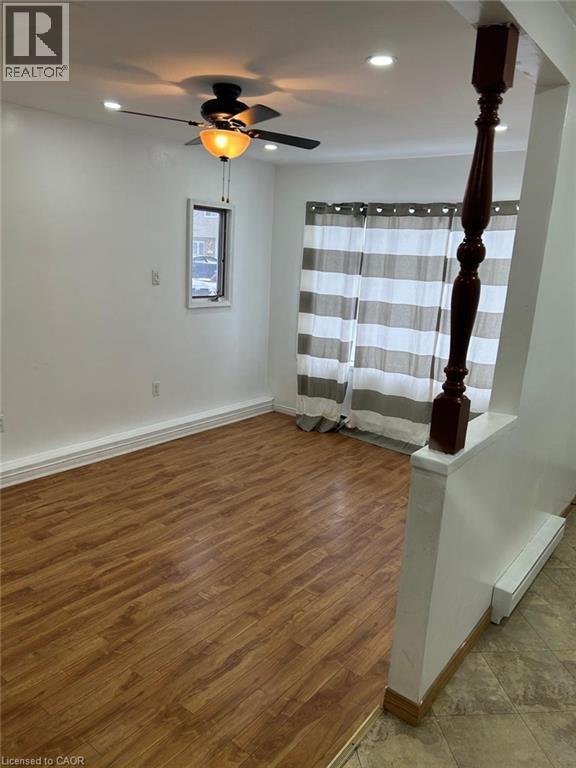 Spacious room with wood-finish flooring, recessed lighting, and a ceiling fan with light fixture - 744 Parkview Crescent, Cambridge, ON - Indoor Photo Showing Other Room