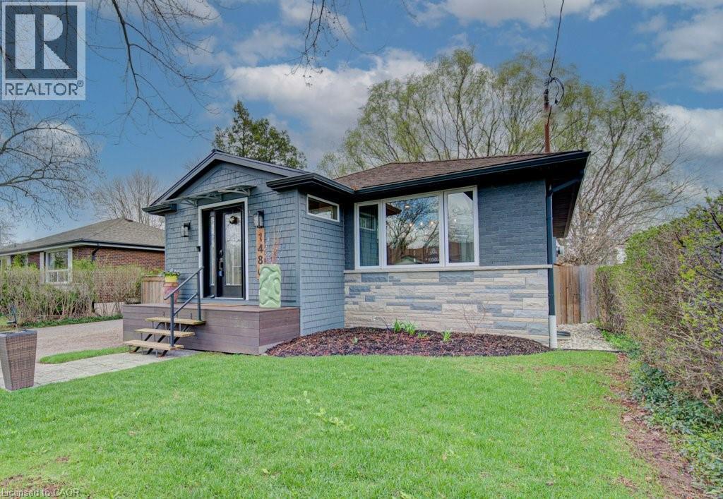Contemporary exterior featuring a combination of horizontal siding, stone veneer, and shake siding - 1486 Augustine Drive, Burlington, ON - Outdoor