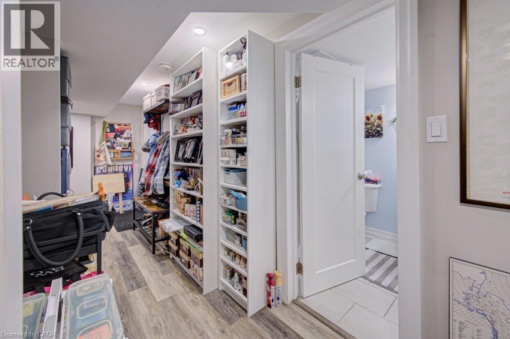 Hallway featuring wood-finish flooring and recessed lighting - 1486 Augustine Drive, Burlington, ON - Indoor