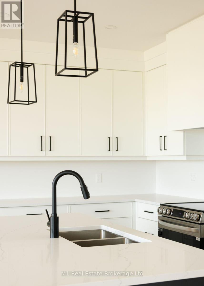 74 Bedell Drive, Mapleton, ON - Indoor Photo Showing Kitchen With Double Sink