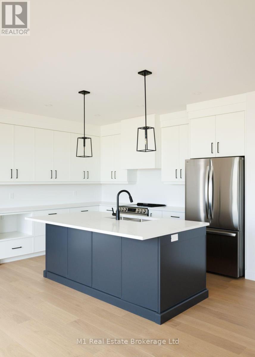 74 Bedell Drive, Mapleton, ON - Indoor Photo Showing Kitchen With Upgraded Kitchen