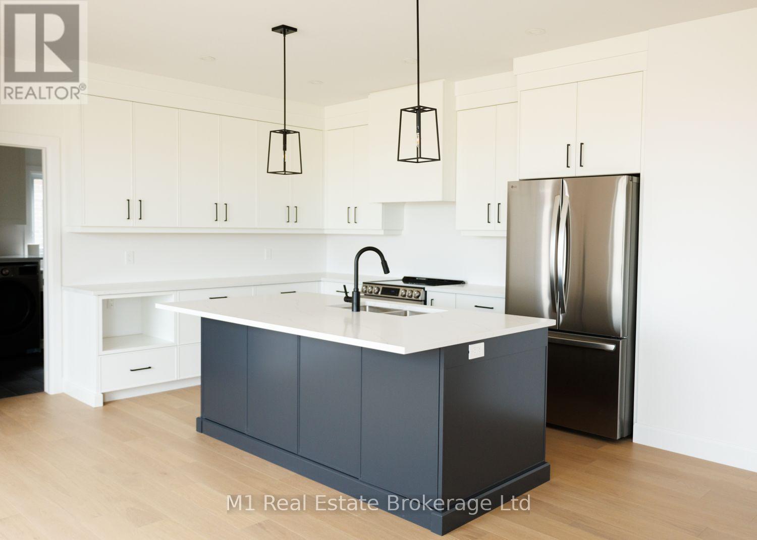 74 Bedell Drive, Mapleton, ON - Indoor Photo Showing Kitchen With Upgraded Kitchen
