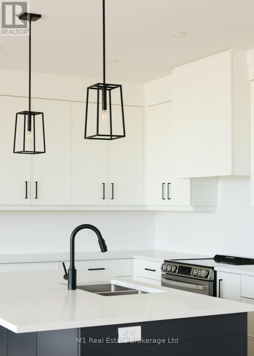 74 Bedell Drive, Mapleton, ON - Indoor Photo Showing Kitchen With Double Sink