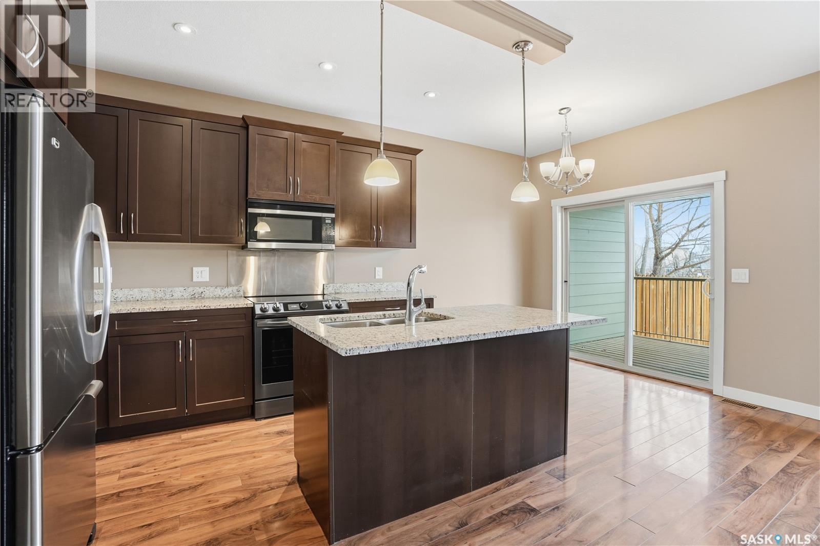 111 115 Shepherd Crescent, Saskatoon, SK - Indoor Photo Showing Kitchen With Stainless Steel Kitchen With Double Sink With Upgraded Kitchen