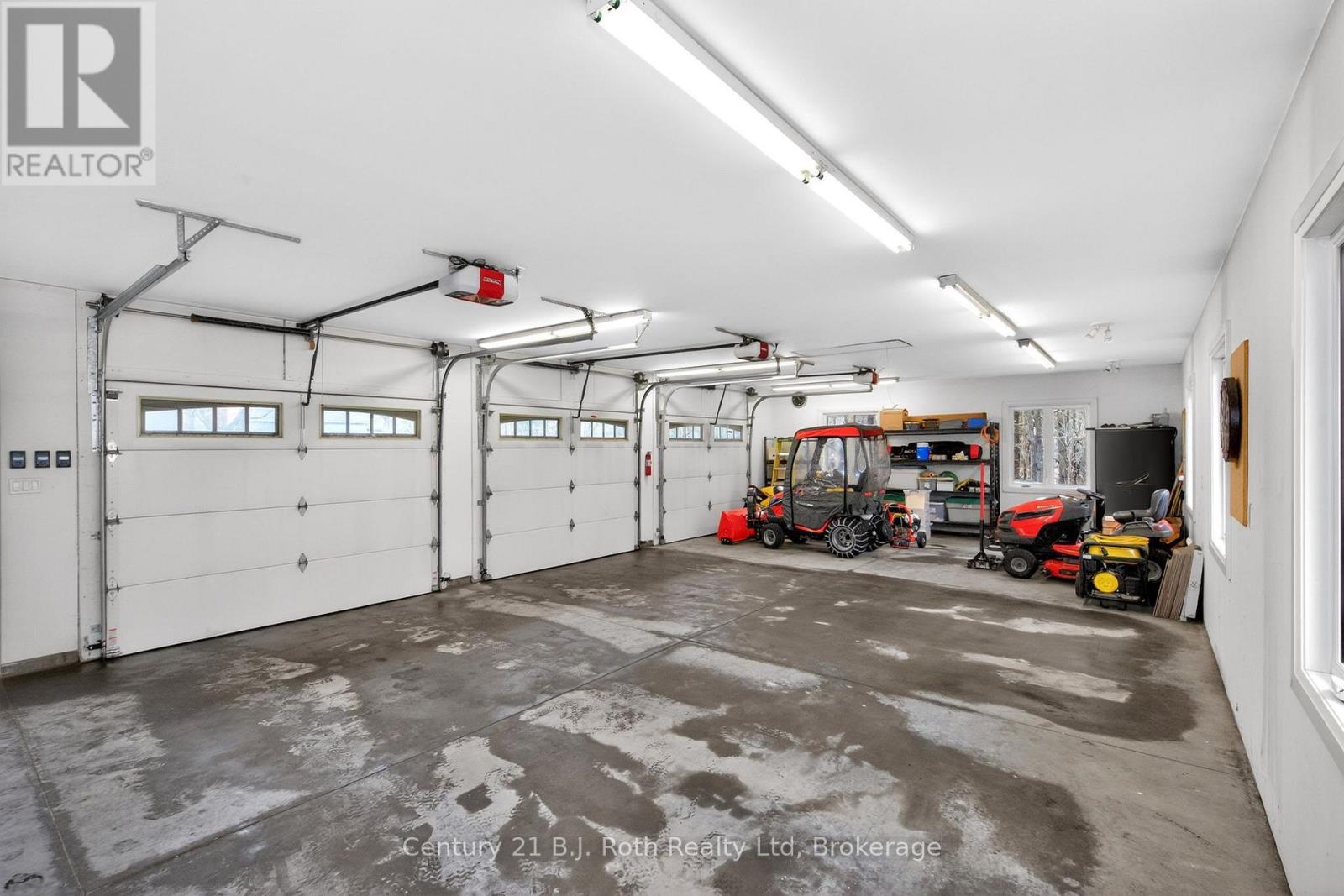 INSULATED TRIPLE GARAGE - 291 Concession Road 8 E, Tiny, ON - Indoor Photo Showing Garage