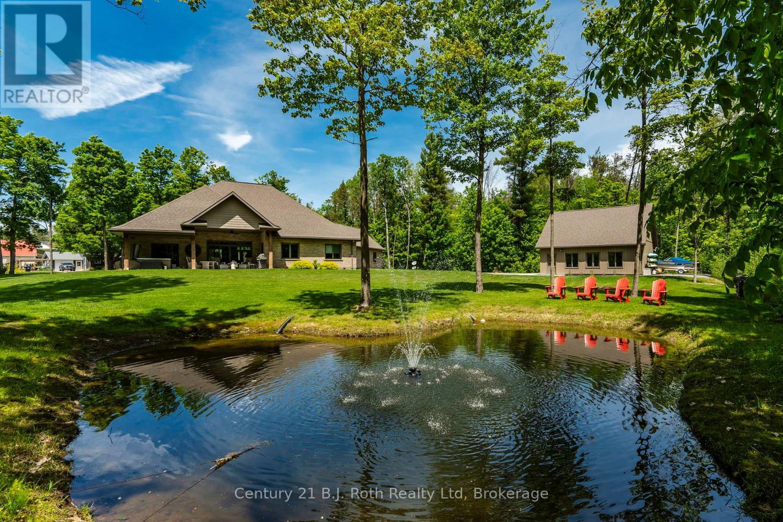 BACKYARD PRIVATE POND - 291 Concession Road 8 E, Tiny, ON - Indoor Photo Showing Garage