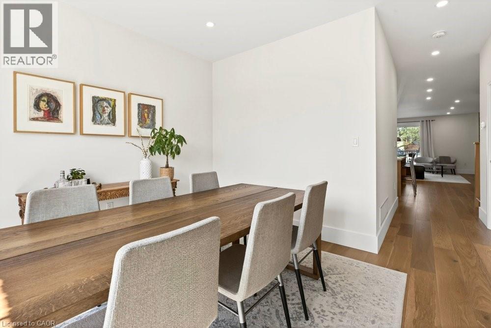 Dining area with recessed lighting, light wood-finish flooring, and white baseboards - 128 Canada Street, Hamilton, ON - Indoor