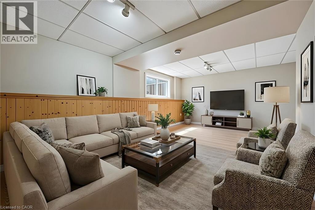 Spacious living area featuring light-toned walls and a drop ceiling - 365 Pioneer Drive Unit# 25, Kitchener, ON - Indoor Photo Showing Living Room