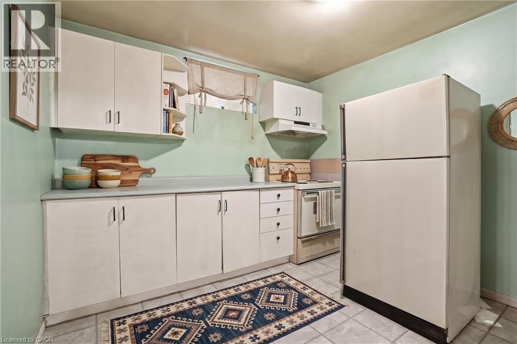Virtually Staged - Second Kitchen in basement - 60 Rexford Drive, Hamilton, ON - Indoor Photo Showing Kitchen