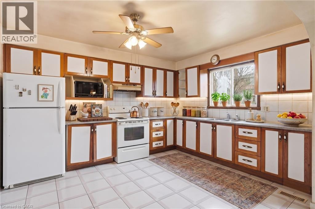 Virtually Staged - 60 Rexford Drive, Hamilton, ON - Indoor Photo Showing Kitchen With Double Sink