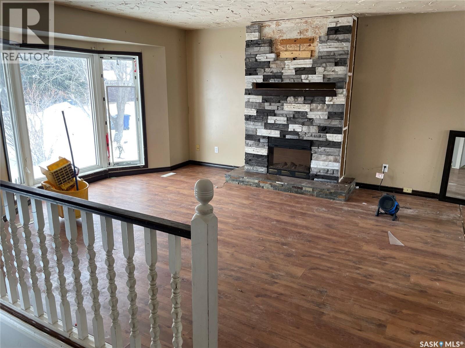 137 1St Street W, Pierceland, SK - Indoor Photo Showing Other Room With Fireplace