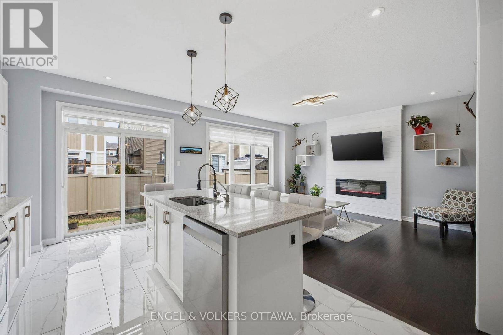 139 Switch Grass Crescent, Ottawa, ON - Indoor Photo Showing Kitchen With Fireplace With Upgraded Kitchen