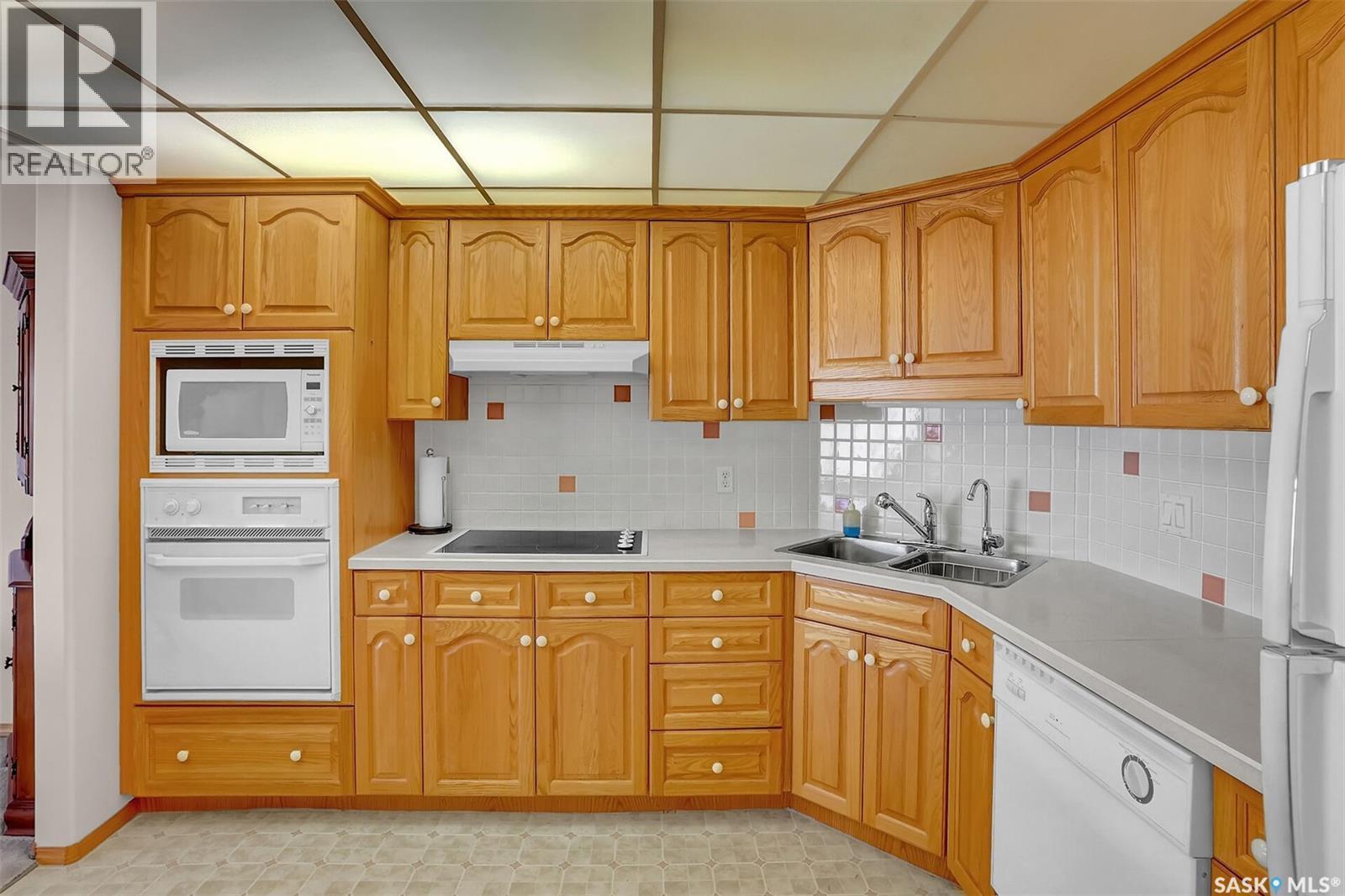 310 2050 College Avenue, Regina, SK - Indoor Photo Showing Kitchen With Double Sink