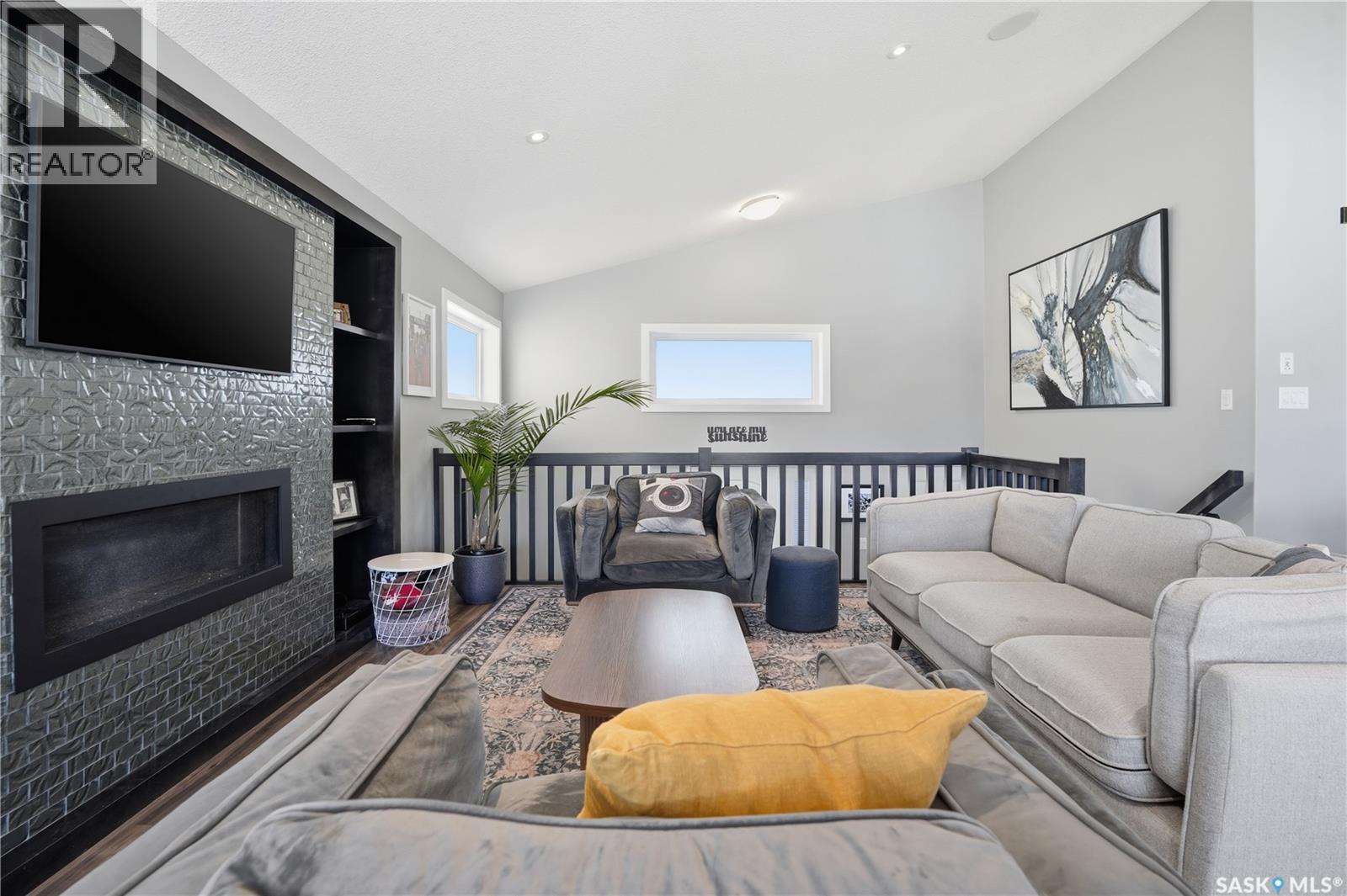 313 Prairie View Drive, Regina, SK - Indoor Photo Showing Living Room With Fireplace