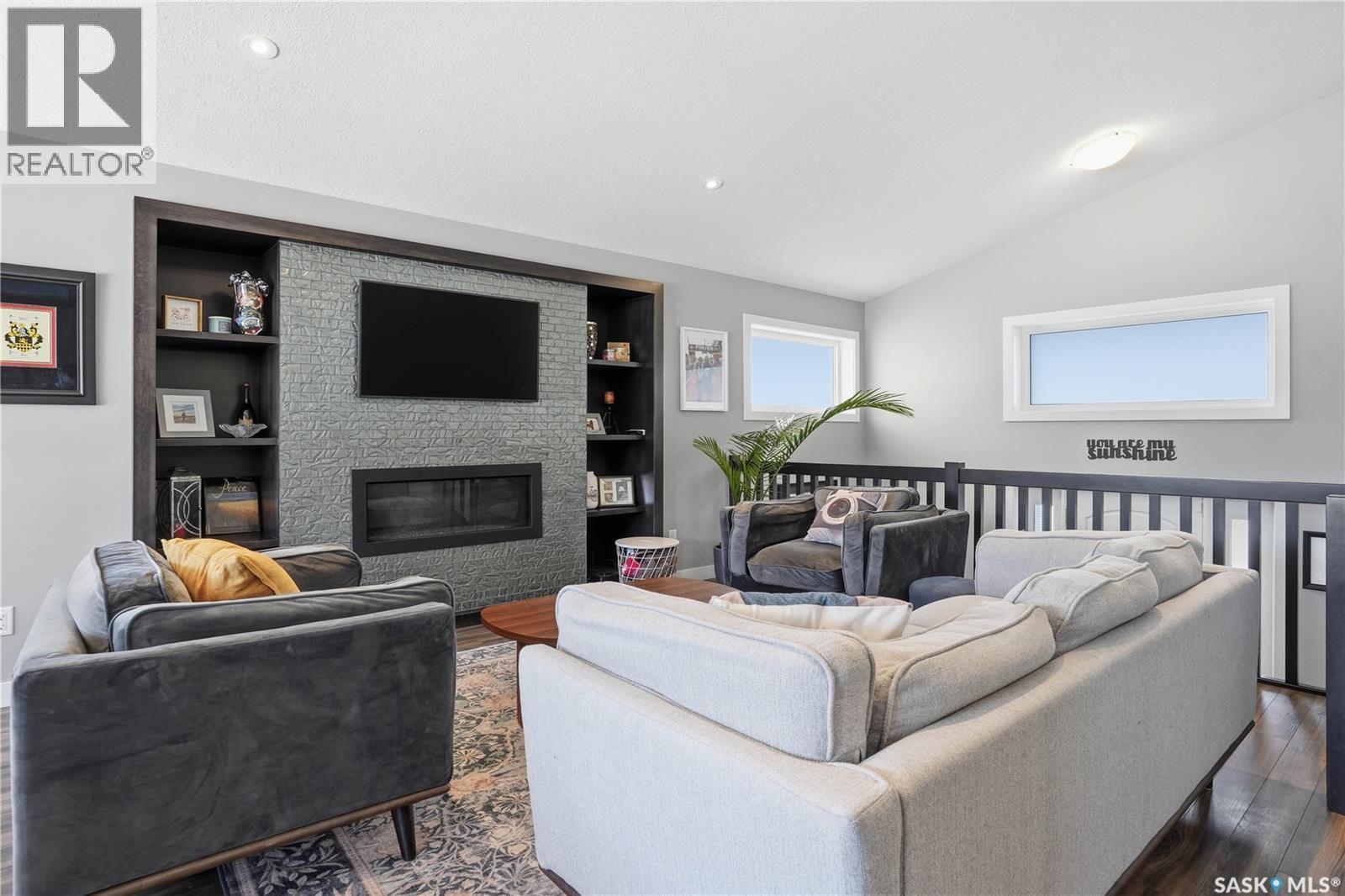 313 Prairie View Drive, Regina, SK - Indoor Photo Showing Living Room With Fireplace
