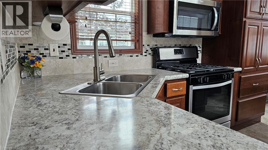 274 Front Road Unit# 88, St. Williams, ON - Indoor Photo Showing Kitchen With Double Sink