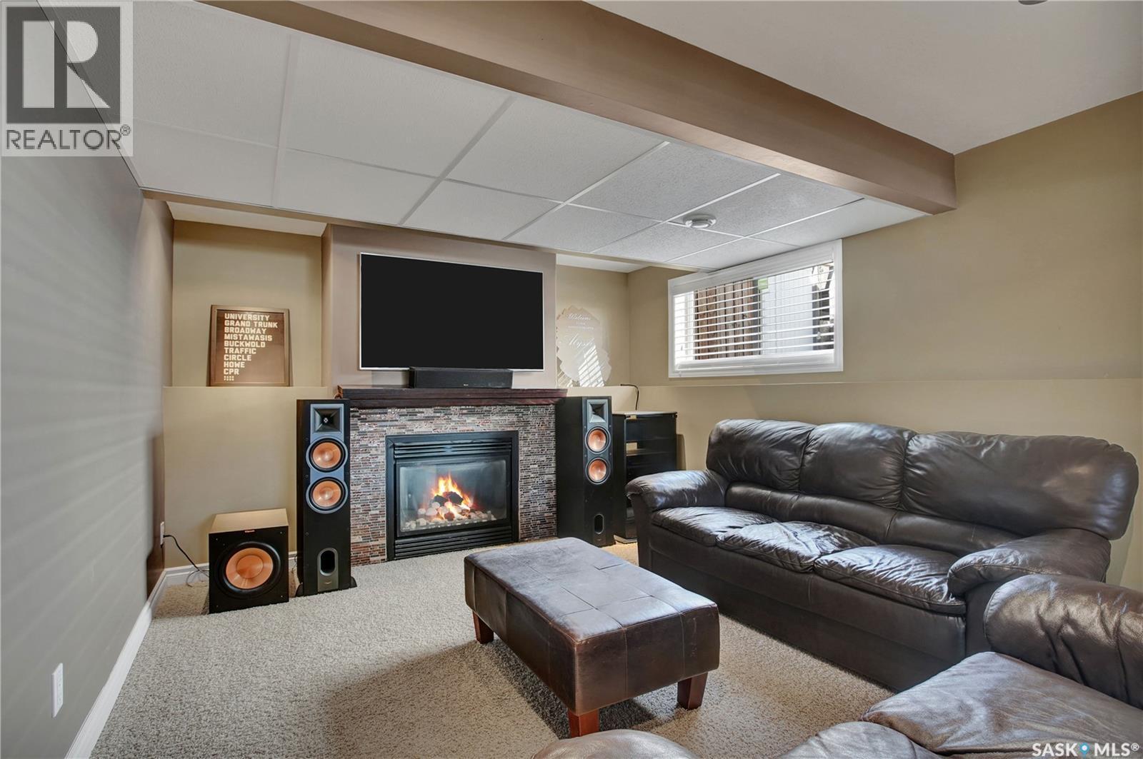 106 Bennion Crescent, Saskatoon, SK - Indoor Photo Showing Other Room With Fireplace