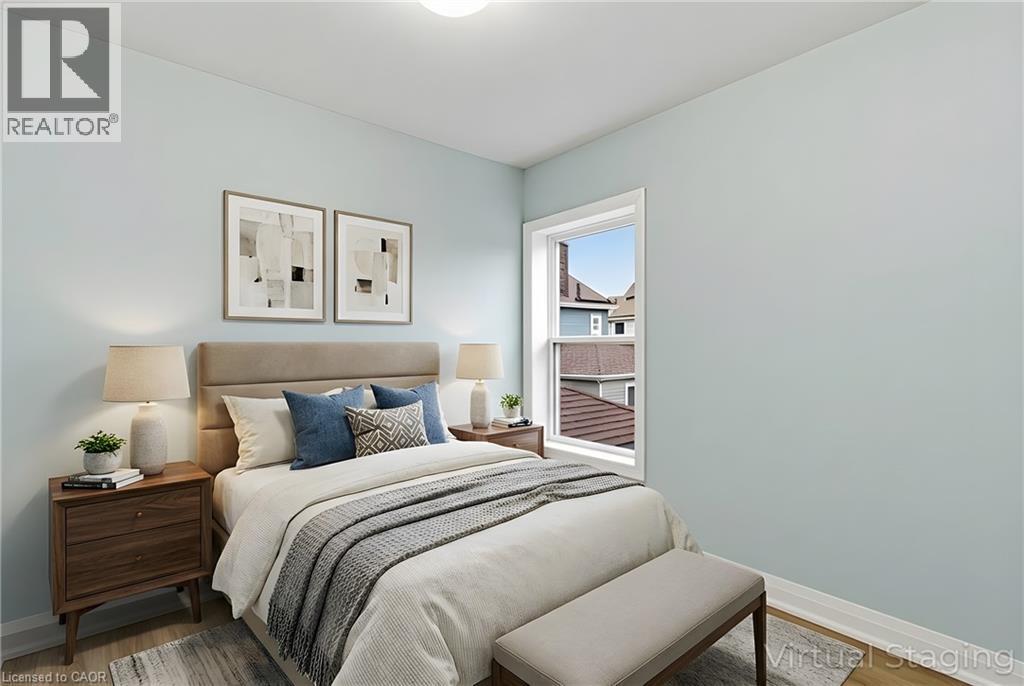 Light blue painted walls with white trim throughout - 149 Lottridge Street, Hamilton, ON - Indoor Photo Showing Bedroom