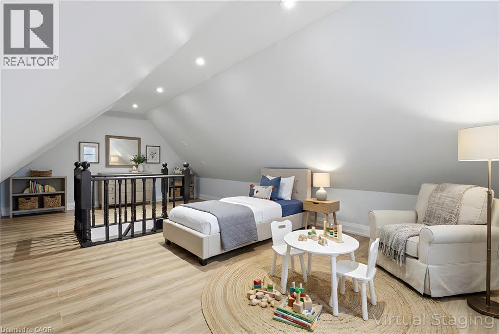 Attic space featuring sloped ceilings, recessed lighting, and wood-finish flooring - 149 Lottridge Street, Hamilton, ON - Indoor Photo Showing Living Room