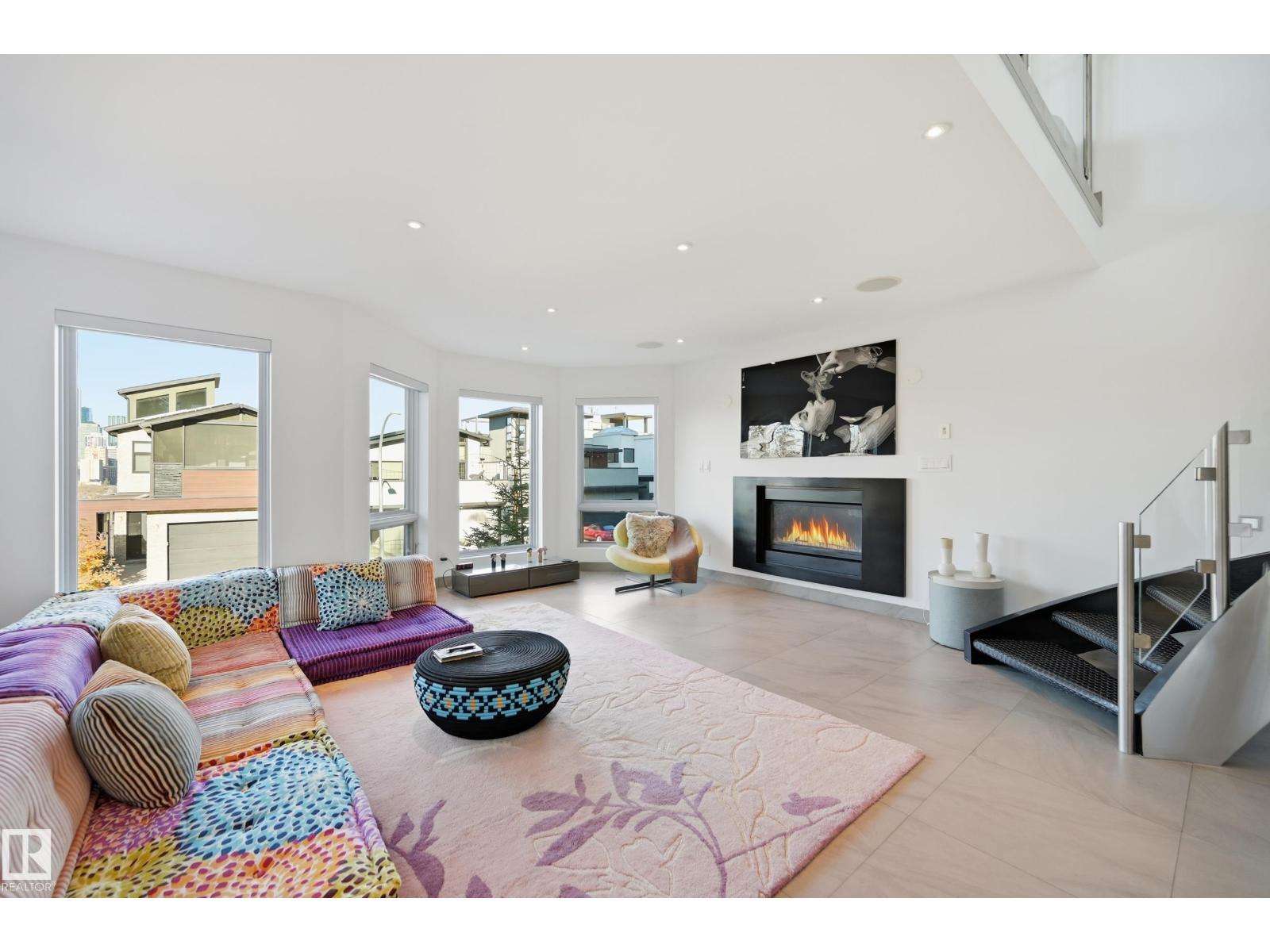 10065 90 Av Nw, Edmonton, AB - Indoor Photo Showing Living Room With Fireplace