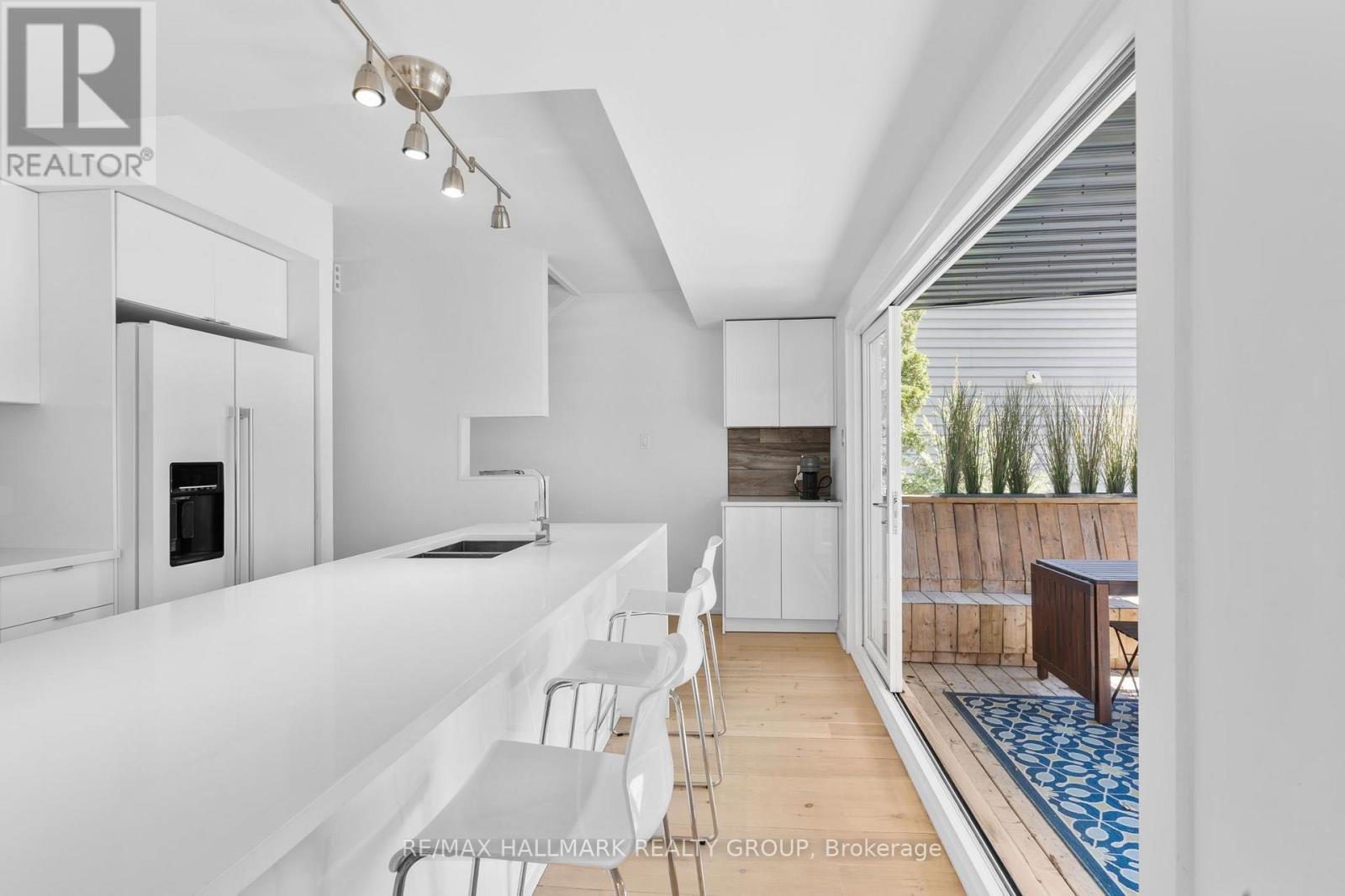 Bright kitchen with sleek modern finishes - 330 Winona Avenue, Ottawa, ON - Indoor Photo Showing Kitchen With Double Sink