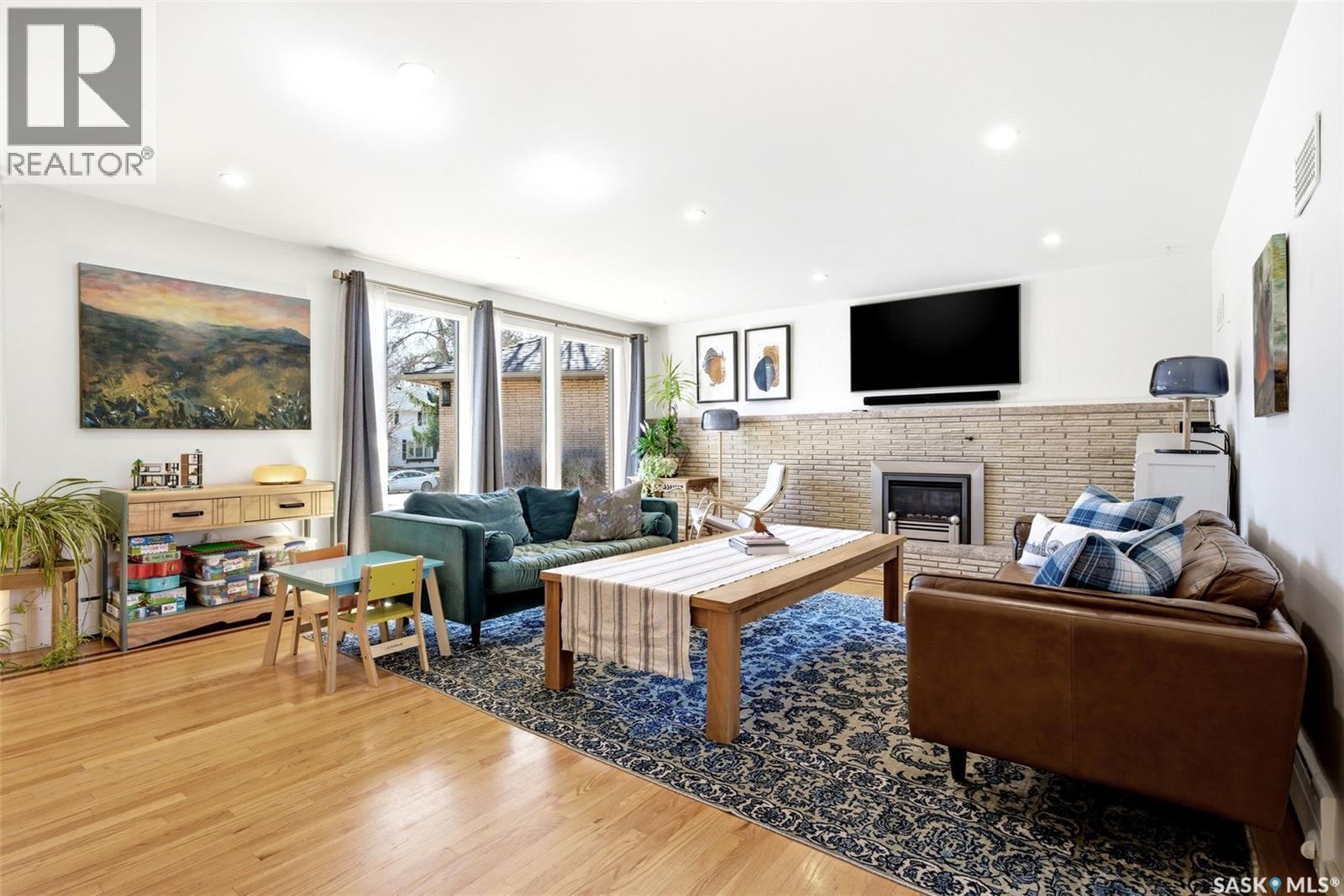 2640 19Th Avenue, Regina, SK - Indoor Photo Showing Living Room With Fireplace