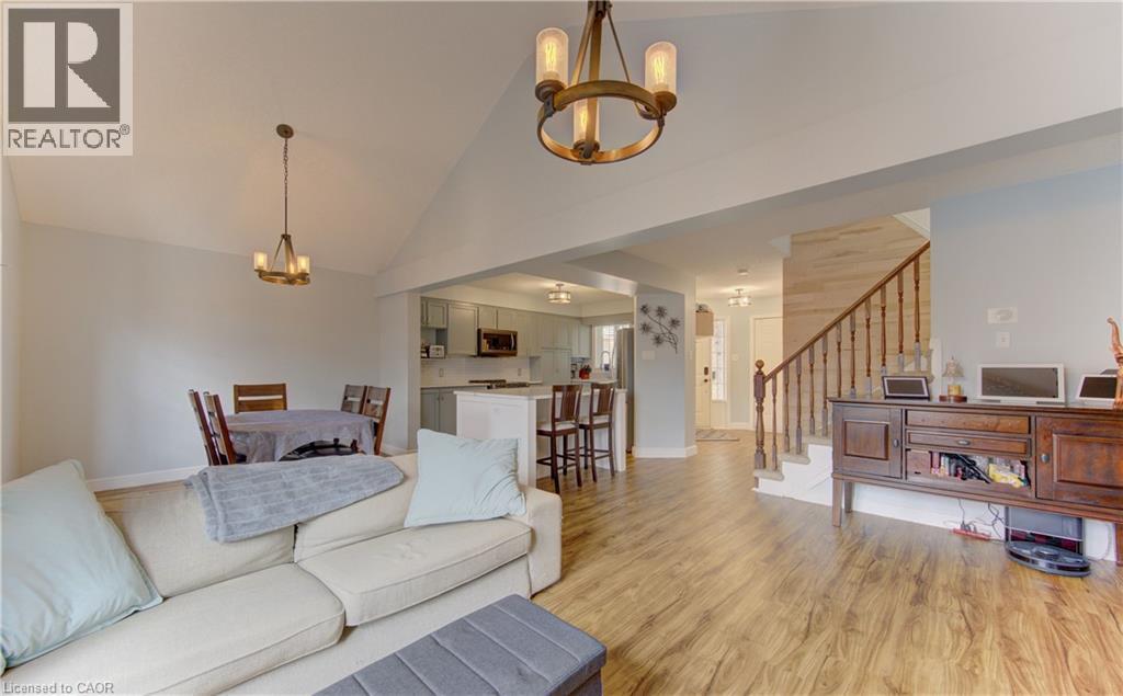 Spacious open-concept interior featuring vaulted ceilings and recessed lighting - 512 Hidden Creek Drive, Kitchener, ON - Indoor Photo Showing Living Room