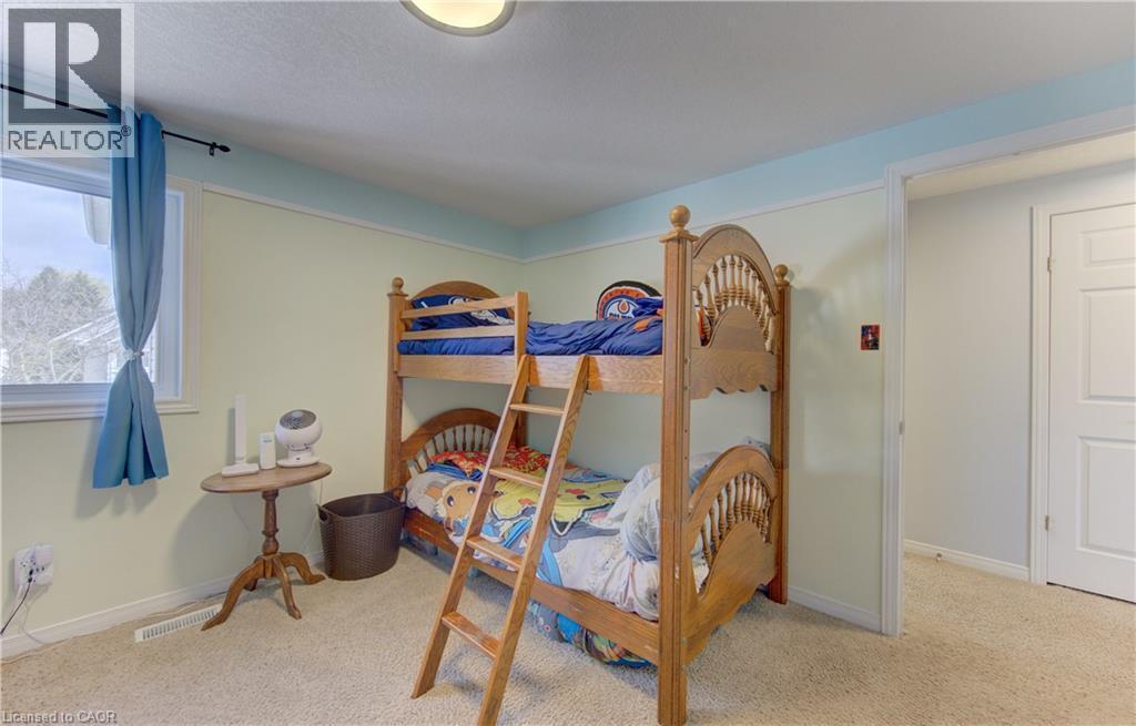 Room featuring a window with natural light, light-toned walls, and soft carpet flooring - 512 Hidden Creek Drive, Kitchener, ON - Indoor Photo Showing Bedroom