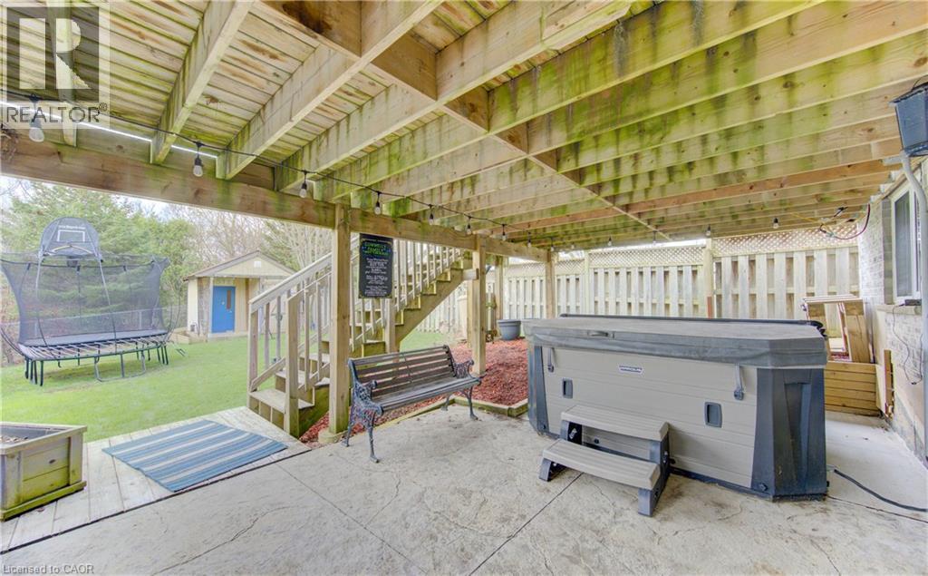 Under-deck patio area stamped concrete surface - 512 Hidden Creek Drive, Kitchener, ON - Outdoor With Deck Patio Veranda With Exterior
