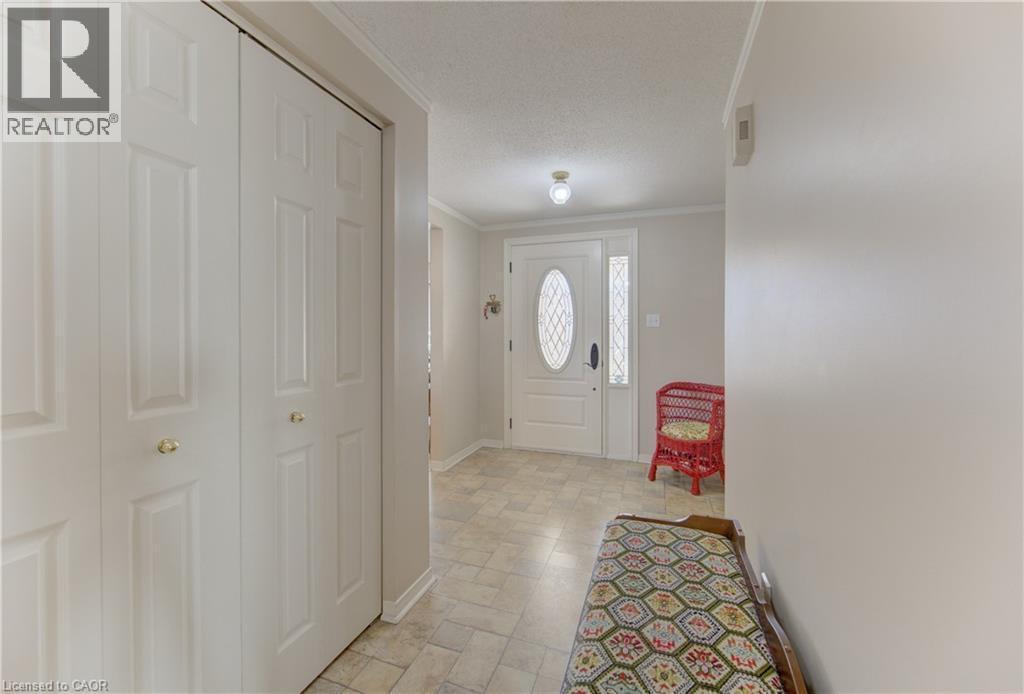 Large Foyer with coat closet and access to garage - 7 Kilkerran Crescent, Kitchener, ON - Indoor Photo Showing Other Room