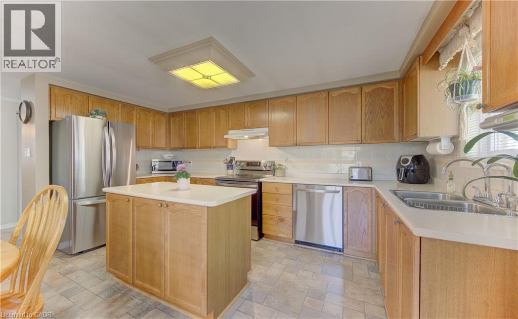 Kitchen has lots of counter space and cabinetry. - 7 Kilkerran Crescent, Kitchener, ON - Indoor Photo Showing Kitchen With Double Sink