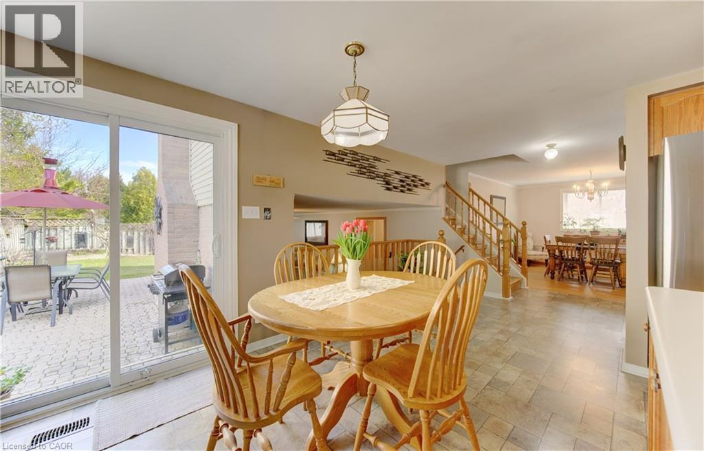 Dinette with handy updated slider to the yard - 7 Kilkerran Crescent, Kitchener, ON - Indoor Photo Showing Dining Room