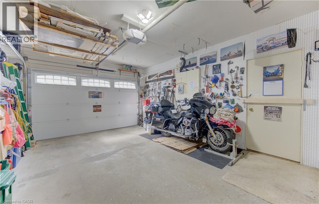 Nice clean garage with access to the yard, and yes it will fit a truck, and a Motorcycle. - 7 Kilkerran Crescent, Kitchener, ON - Indoor Photo Showing Garage