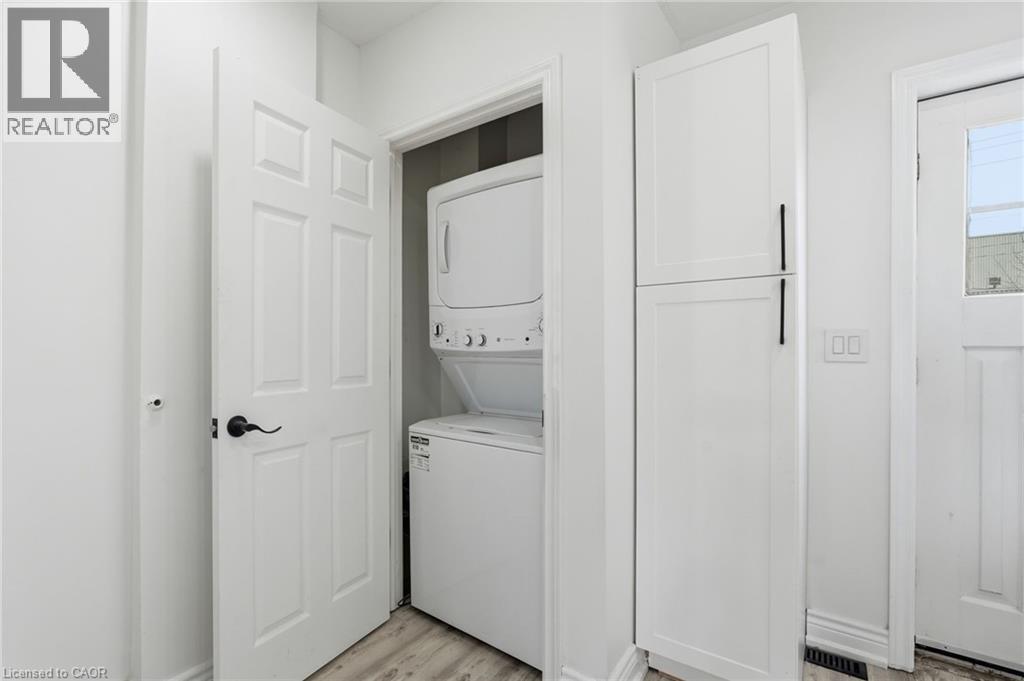 Convenient in-suite laundry on the main level. - 73 Gertrude Street, Hamilton, ON - Indoor Photo Showing Laundry Room