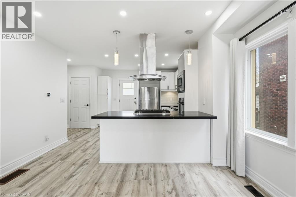 Kitchen and living area - 73 Gertrude Street, Hamilton, ON - Indoor Photo Showing Kitchen