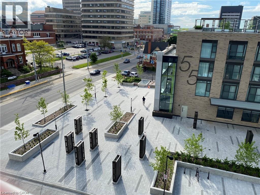 Contemporary building facade with light-colored brick and prominent numerical signage - 85 Duke Street W Unit# 507, Kitchener, ON - Outdoor