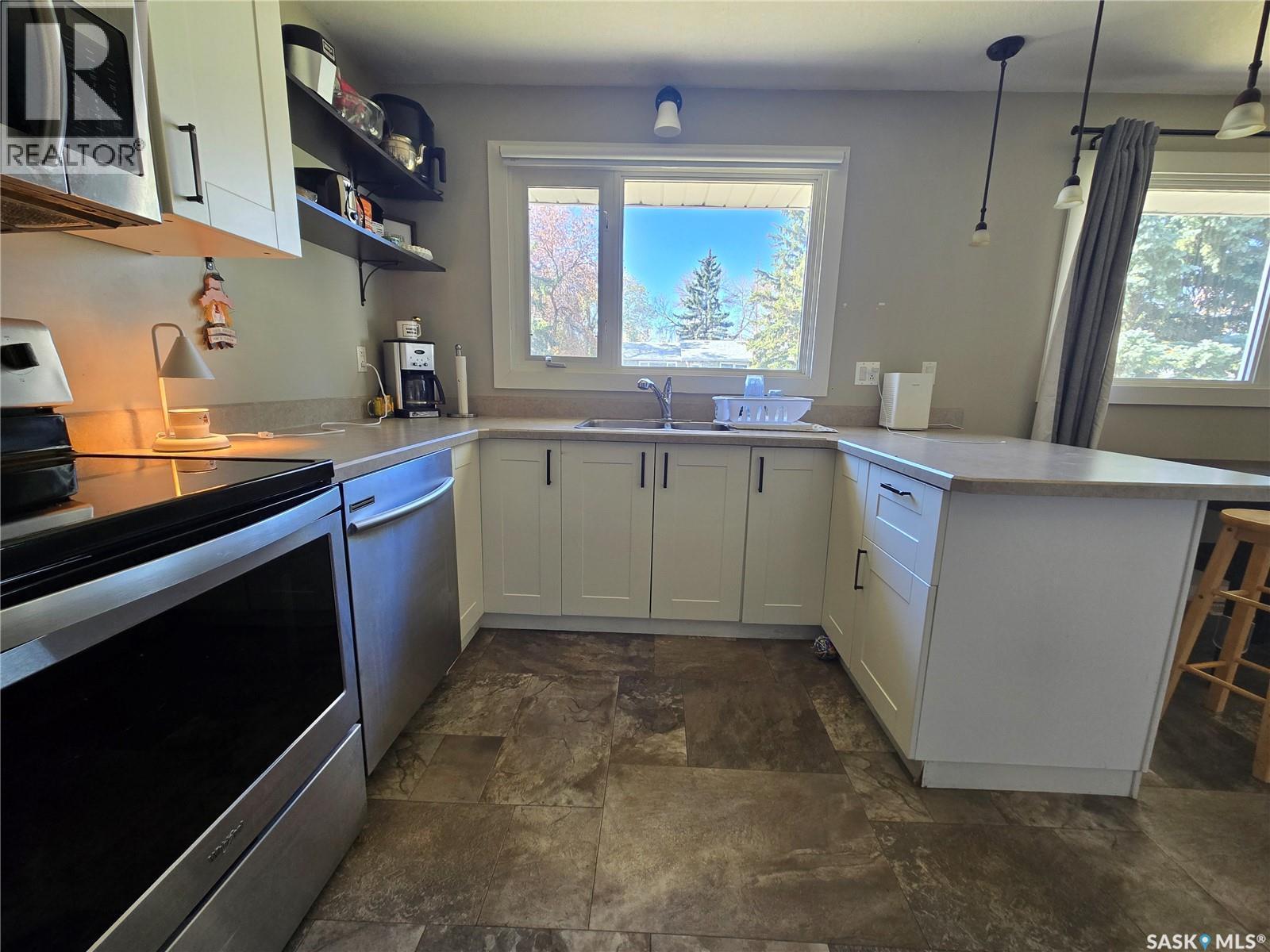 719 3Rd Street E, Assiniboia, SK - Indoor Photo Showing Kitchen With Double Sink