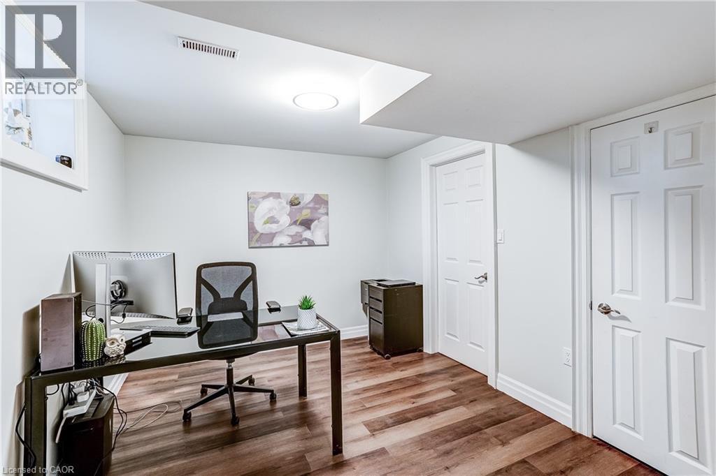 Finished room featuring wood-finish flooring, white painted walls, recessed lighting, and a window - 1264 Kane Road, Mississauga, ON - Indoor Photo Showing Office