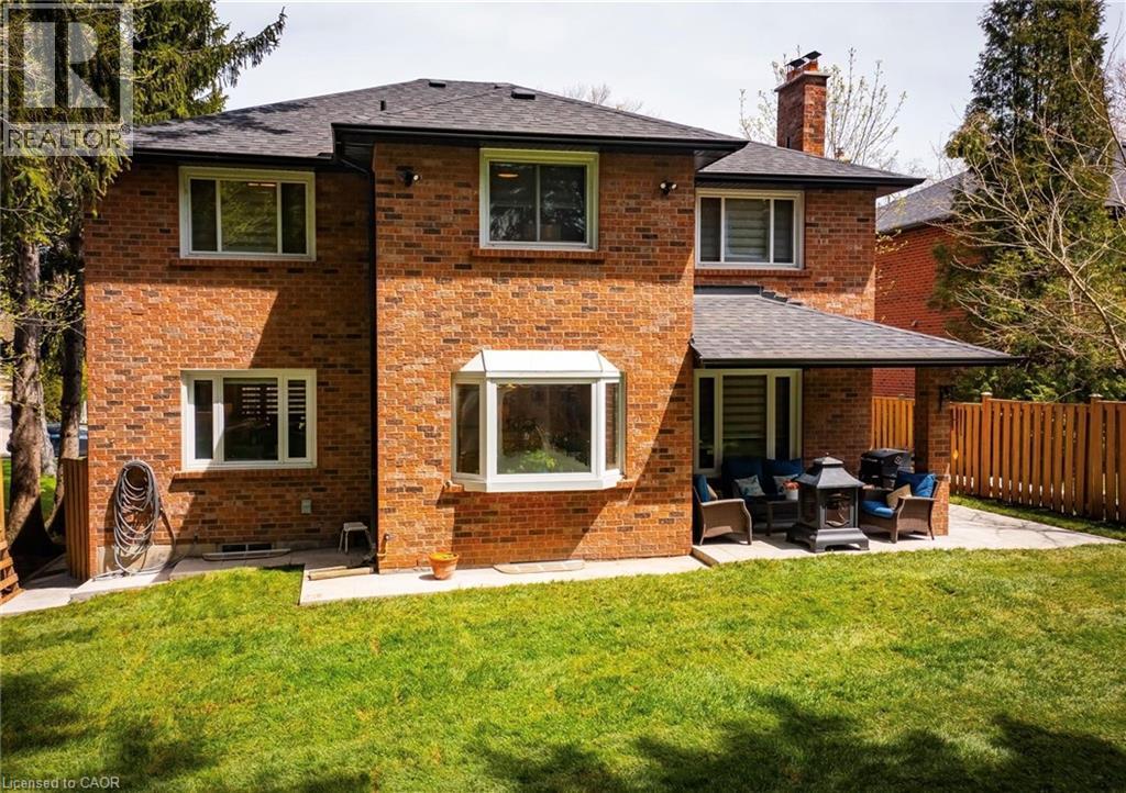 Brick exterior with a gabled roof and covered patio area - 1264 Kane Road, Mississauga, ON - Outdoor With Exterior