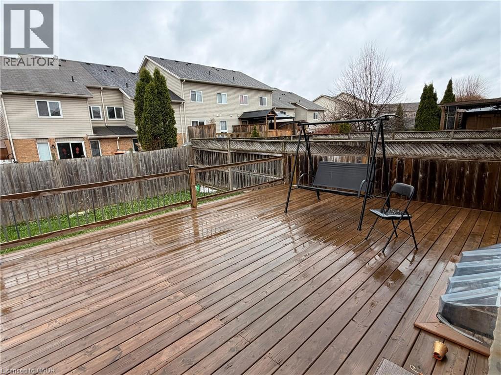 Expansive wood deck with a perimeter railing and privacy fencing - 1126 Copper Leaf Crescent, Kitchener, ON - Outdoor With Deck Patio Veranda With Exterior