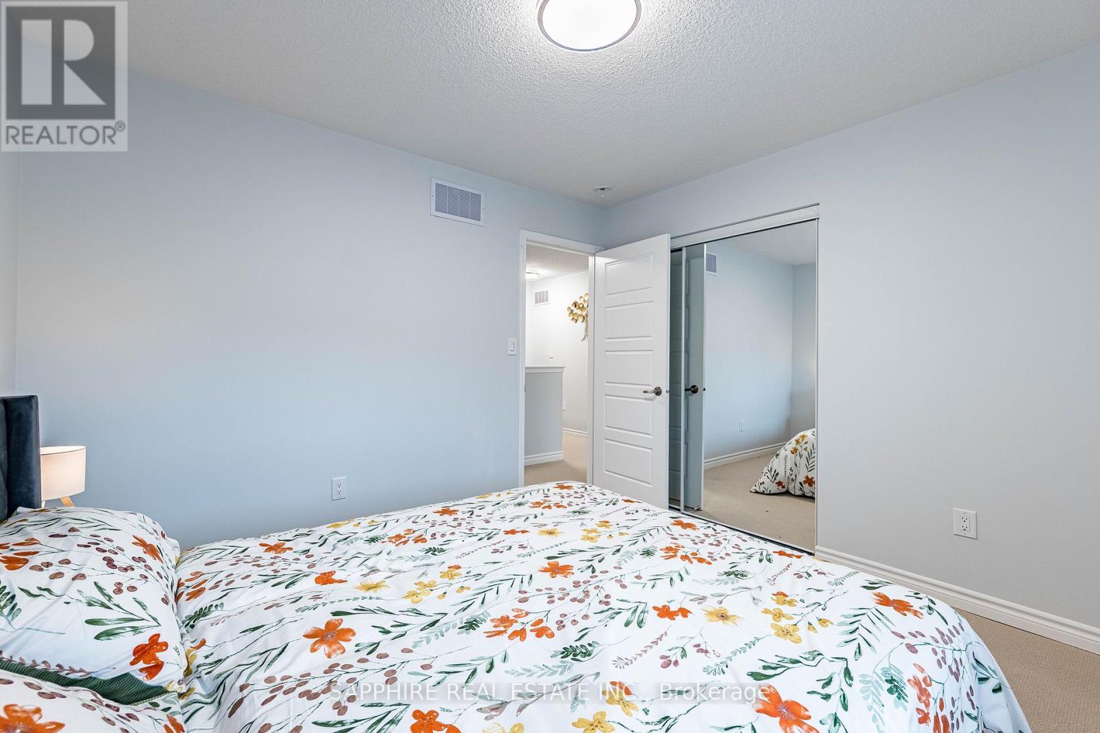 Bedroom 2 with Mirrored Closet - 325 Trudeau Drive E, Milton, ON - Indoor Photo Showing Bedroom