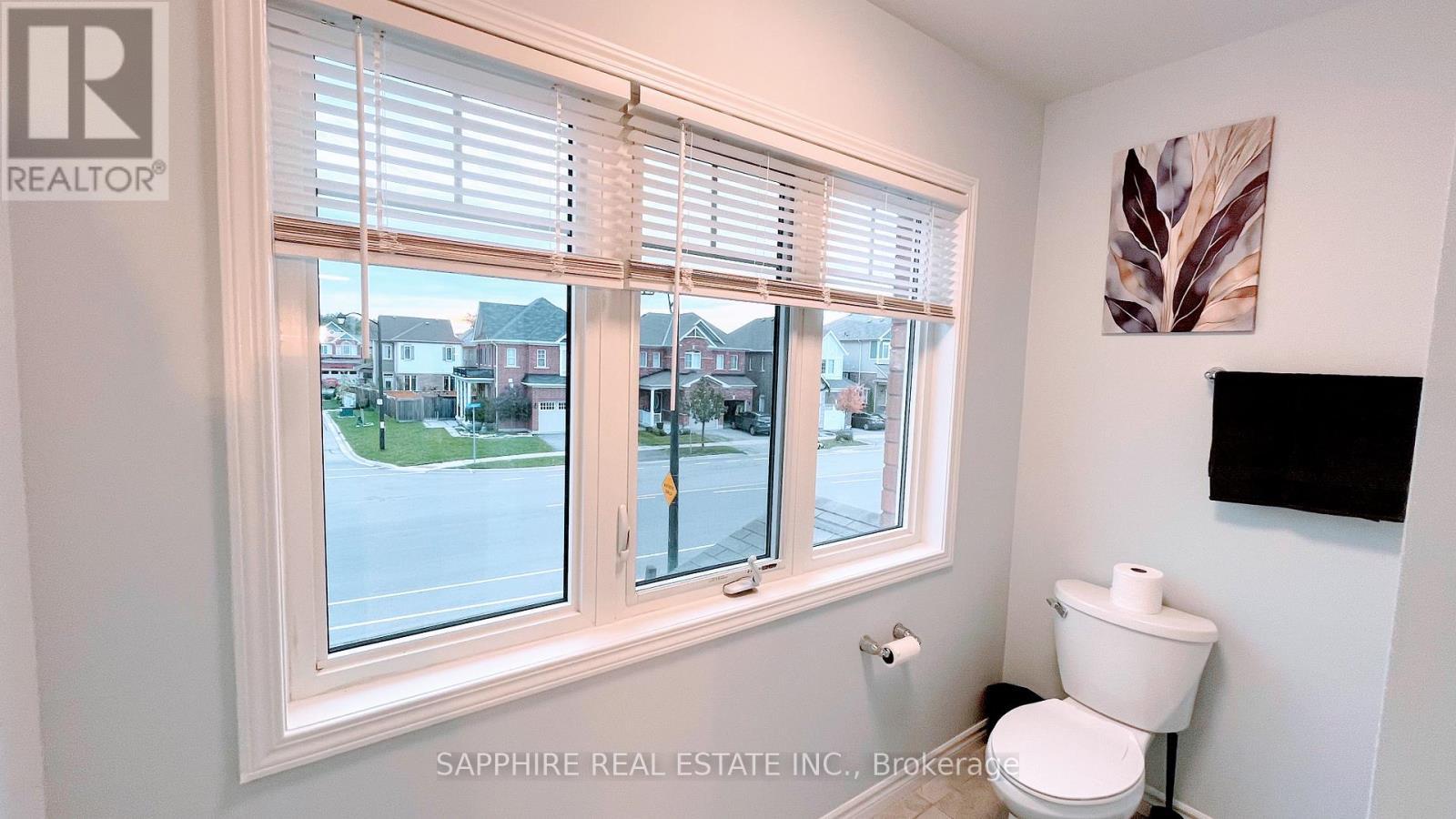 Common Washroom with Large window and Tub - 325 Trudeau Drive E, Milton, ON - Indoor Photo Showing Bathroom