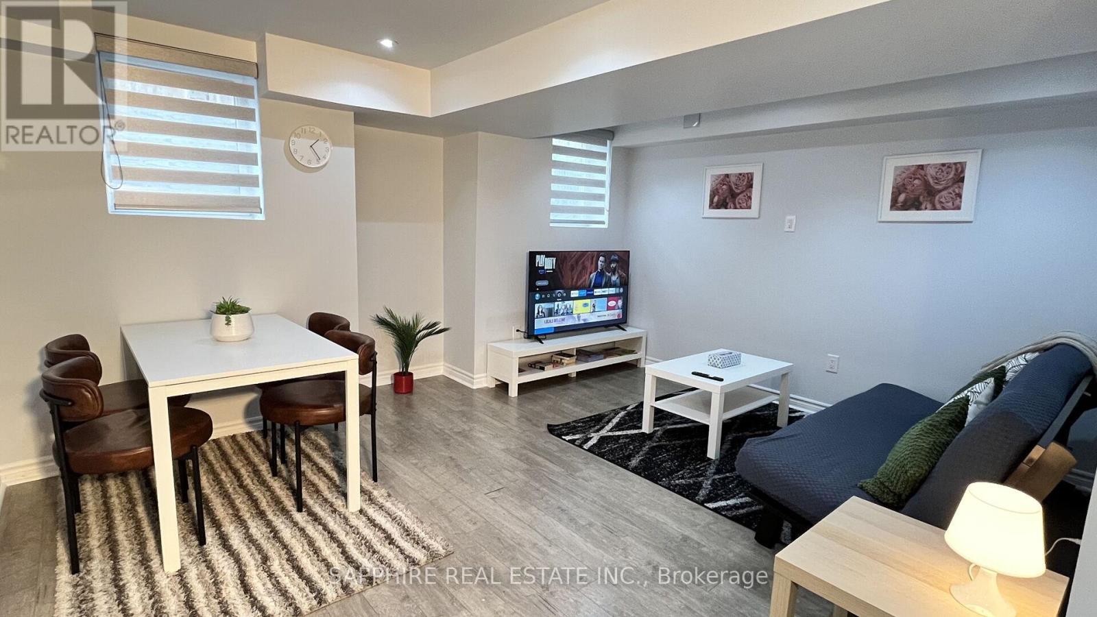 Basement living and Dining - 325 Trudeau Drive E, Milton, ON - Indoor
