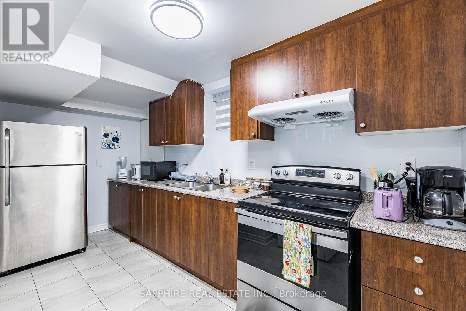 Basement Kitchen with large window - 325 Trudeau Drive E, Milton, ON - Indoor Photo Showing Kitchen With Double Sink