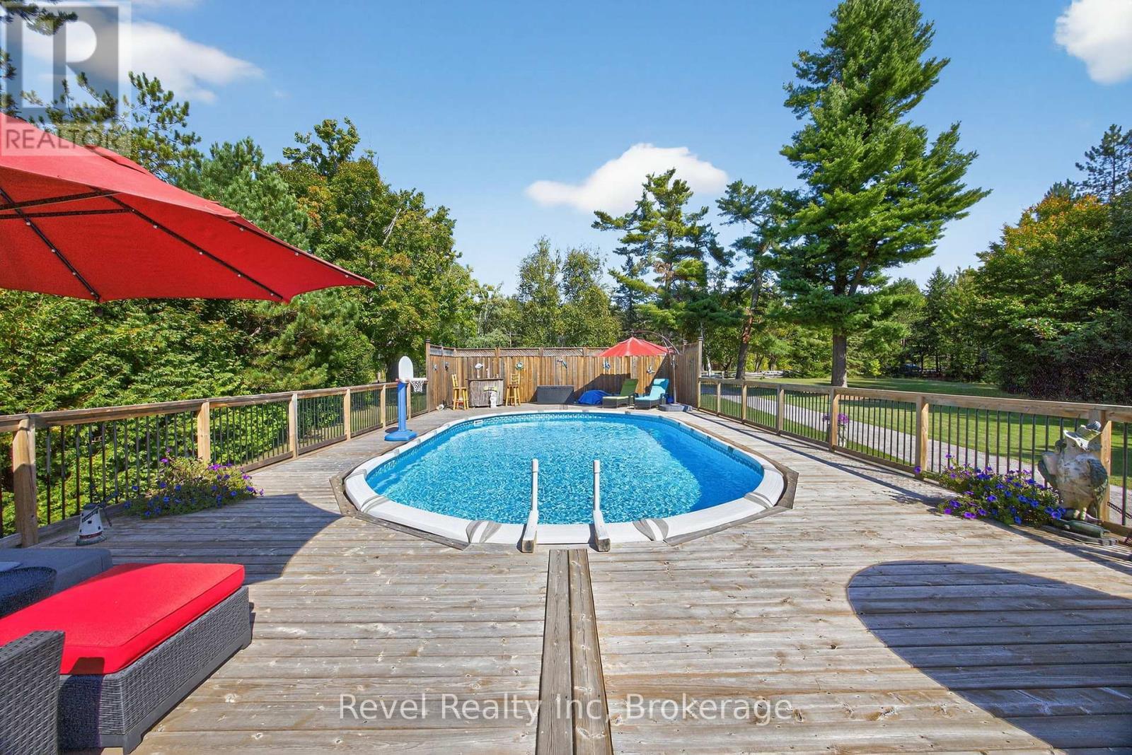 7190 93 Highway, Tiny, ON - Outdoor With Above Ground Pool With Deck Patio Veranda