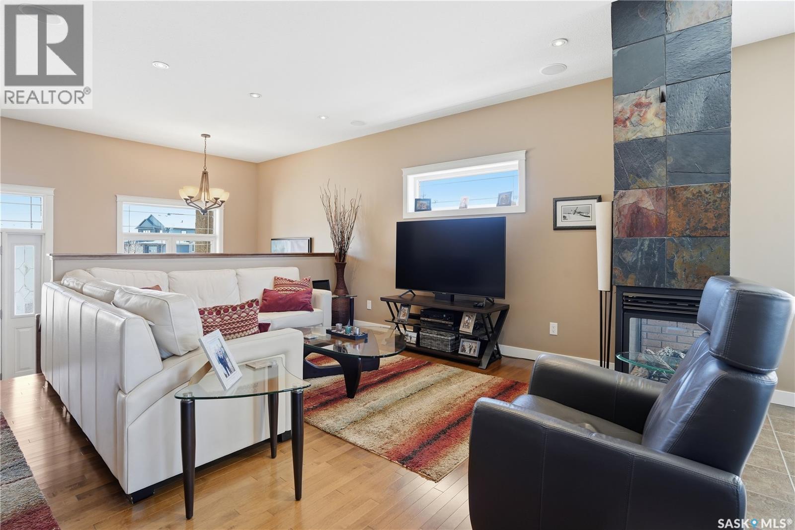 4150 Goldfinch Way, Regina, SK - Indoor Photo Showing Living Room With Fireplace